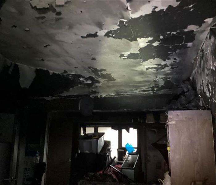 A room with severe fire damage.